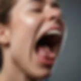 A close-up of a person yawning, illustrating the physiological aspect of yawning.